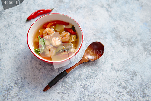 Image of Traditional Tom Yum spicy Thai soup with shrimp