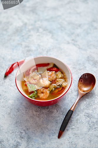 Image of Traditional Tom Yum spicy Thai soup with shrimp