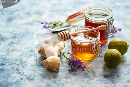 Image of Healthy food table with different kinds of honey, fresh ginger and lime