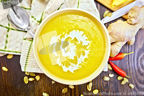 Image of Soup-puree pumpkin with cream in bowl on board top