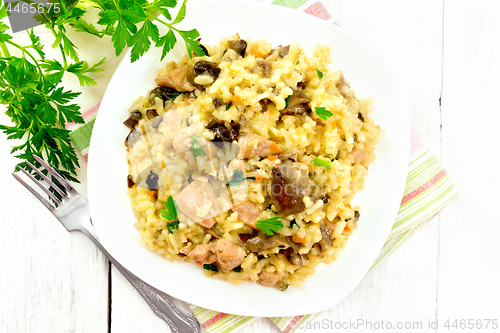 Image of Risotto with mushrooms and chicken on board top