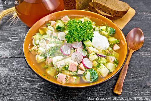 Image of Okroshka in bowl on black wooden board