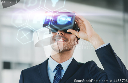 Image of businessman with virtual reality headset at office