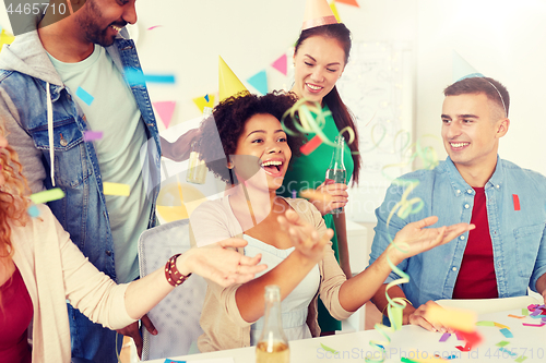 Image of happy team having fun at office party