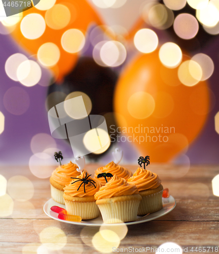 Image of halloween party decorated cupcakes on plate