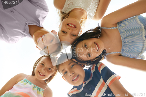 Image of group of happy children in circle