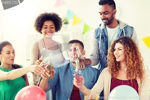 Image of happy team with drinks celebrating at office party