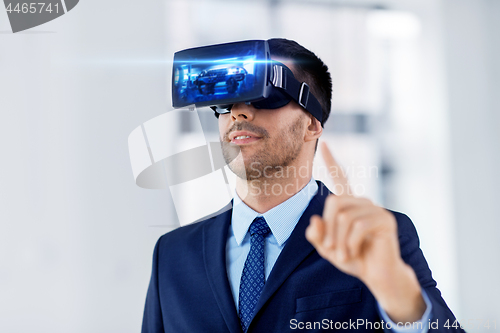 Image of businessman with virtual reality headset at office