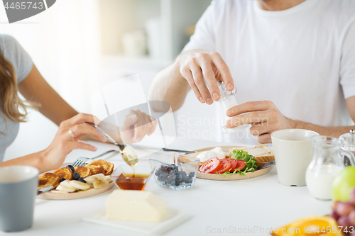 Image of close up of couple having breakfast at home