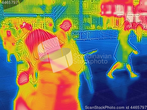 Image of Infrared Thermal image of people walking the city streets on a c