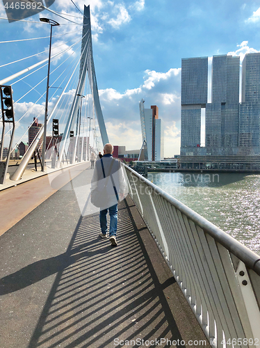 Image of Tourist on Erasmus bridge crossing river