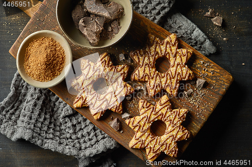 Image of freshly baked cookies decorated with chocolate and sugar