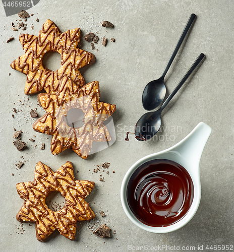 Image of chocolate sauce and star shaped cookies
