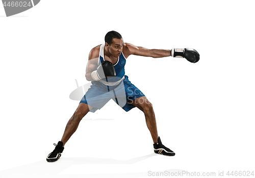 Image of Sporty man during boxing exercise making hit. Photo of boxer on white background