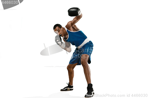 Image of Sporty man during boxing exercise making hit. Photo of boxer on white background