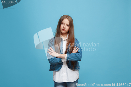 Image of Young serious thoughtful teen girl. Doubt concept.