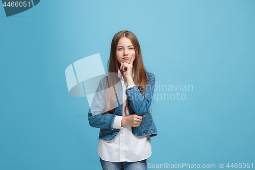 Image of Young serious thoughtful teen girl. Doubt concept.