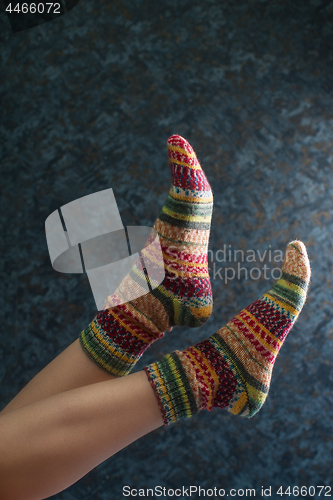 Image of Woman legs in wool knitted socks
