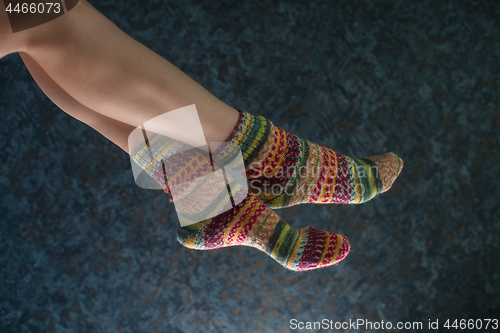 Image of Woman legs in wool knitted socks