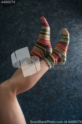Image of Woman legs in wool knitted socks