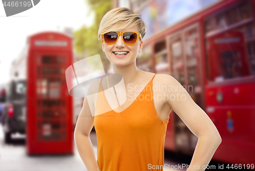 Image of happy teenage girl over london city street