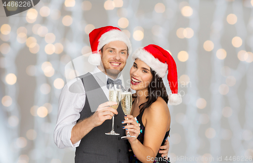 Image of couple with champagne glasses at christmas party