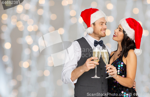 Image of couple with champagne glasses at christmas party