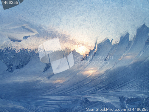 Image of Beautiful ice pattern and sunlight on glass