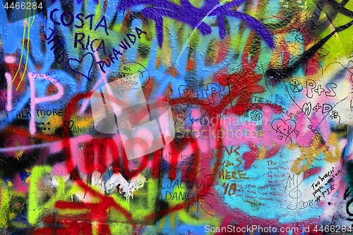 Image of Detail of bright colorful John Lennon's wall with graffiti in Pr