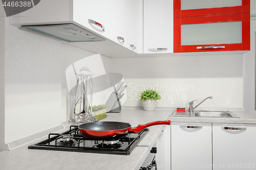 Image of Modern red and white kitchen interior