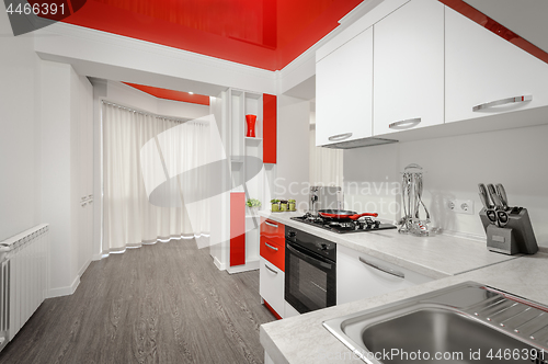 Image of Modern red and white kitchen interior