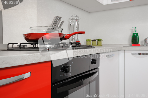 Image of Modern red and white kitchen interior
