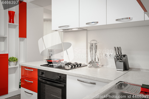 Image of Modern red and white kitchen interior