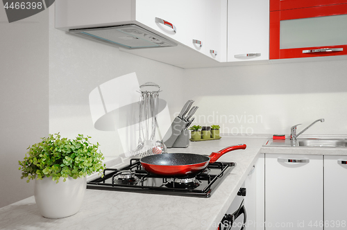 Image of Modern red and white kitchen interior