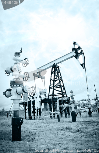 Image of Pump jack and oilwell.