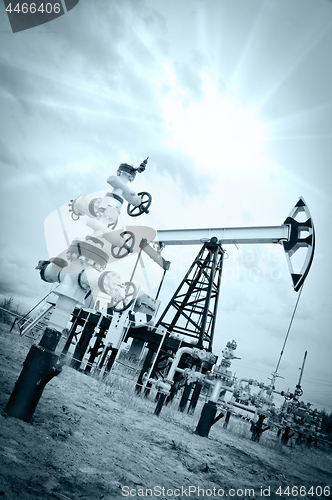 Image of Pump jack and oilwell.