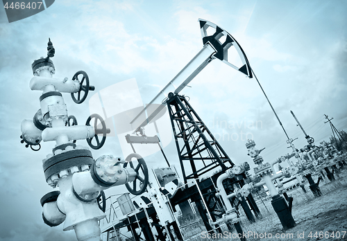 Image of Pump jack and oilwell.