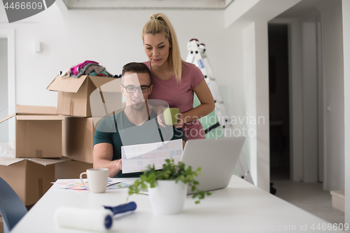 Image of Young couple moving in a new home