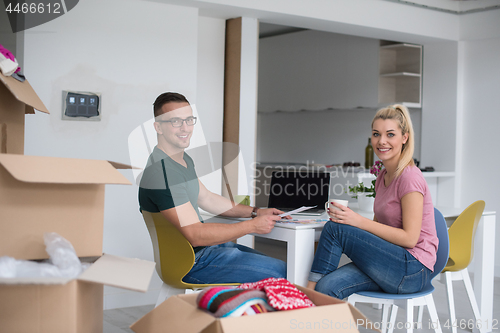 Image of Young couple moving in a new home