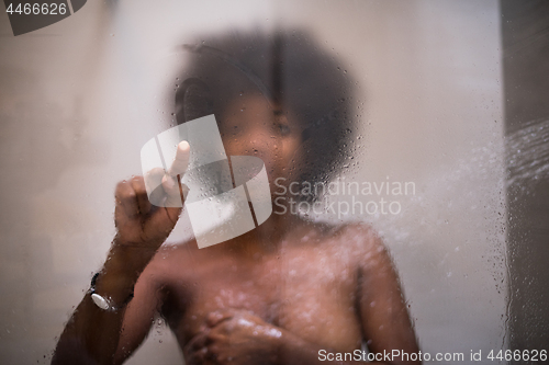 Image of African American woman in the shower