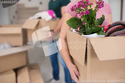 Image of young couple moving into a new home