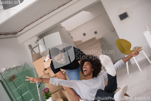 Image of African American couple  playing with packing material