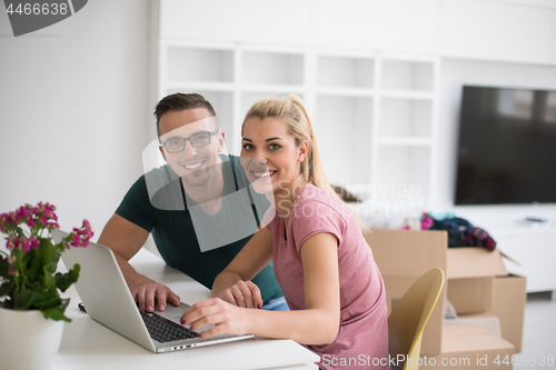 Image of Young couple moving in a new home