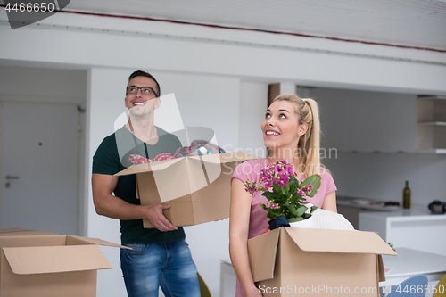 Image of young couple moving into a new home