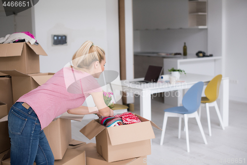 Image of girl moving in the new apartment