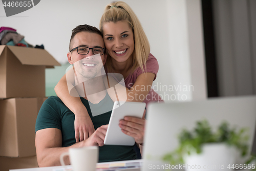 Image of Young couple moving in a new home