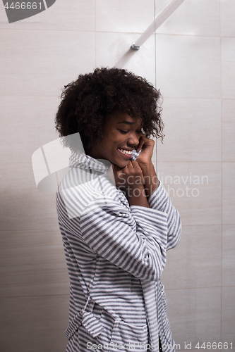 Image of beautiful black woman wearing  bathrobe