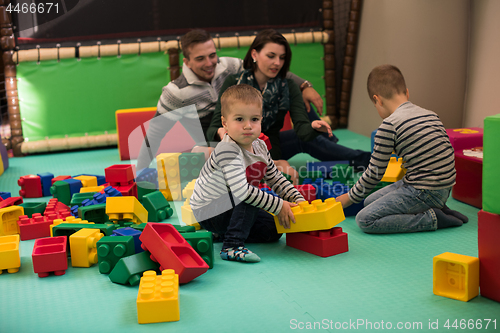 Image of parents having fun with kids