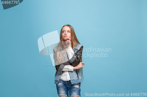 Image of Young serious thoughtful teen girl. Doubt concept.