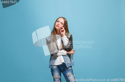 Image of Young serious thoughtful teen girl. Doubt concept.